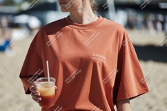 Woman wearing terracotta t shirt holding drink image Product Image 1
