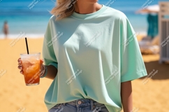 Woman wearing mint t shirt holding drink image Product Image 1