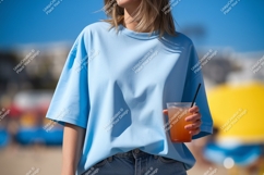 Light blue t shirt holding drink straw Product Image 1