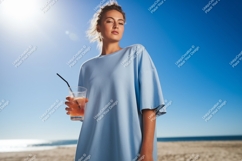 Woman holding drink on beach summer blue Product Image 1