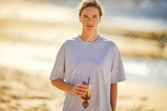 Woman holding drink on beach sunglasses Product Image 1