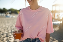 Pink shirt woman holding drink beach glass Product Image 1