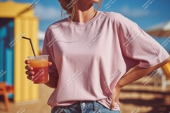 Pink shirt person holding drink beach Product Image 1