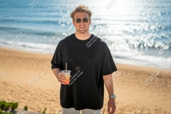 Man black t shirt holding drink beach t-shirt Product Image 1