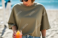 Woman wearing olive green t shirt holding cocktail Product Image 1
