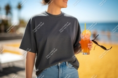 Woman holding orange drink sunglasses t-shirt beach Product Image 1
