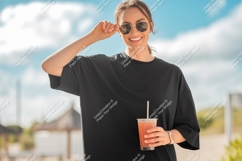 Woman wearing black tshirt holding drink sunglasses Product Image 1