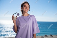 Woman holding drink sunglasses by ocean beach Product Image 1