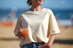 Woman holding drink on beach summer casual Product Image 1