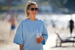 Woman holding refreshing drink on beach sunglasses Product Image 1