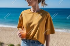 Woman holding orange drink on beach ocean summer Product Image 1