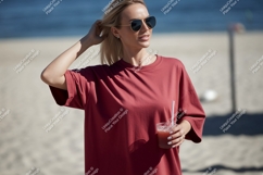 Woman wearing red t shirt holding drink on beach image Product Image 1