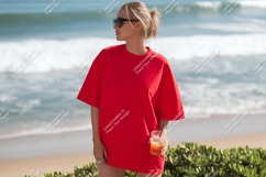 Red shirt woman beach drink ocean Product Image 1