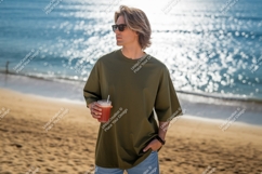 Man holding drink on beach ocean sunglasses Product Image 1