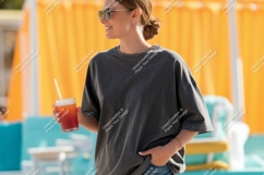Woman holding drink wearing grey t shirt image Product Image 1