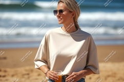 Blonde woman wearing sunglasses holding drink on beach Product Image 1
