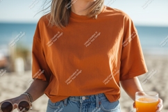 Orange shirt blue jeans beach drink image Product Image 1