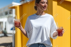 Woman holding drinks white shirt yellow background Product Image 1