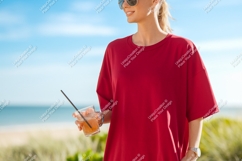 Woman wearing red shirt holding drink beach Product Image 1