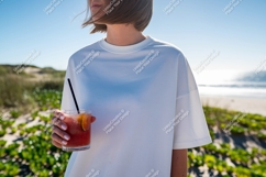 Woman holding refreshing beverage on sandy shore drink Product Image 1