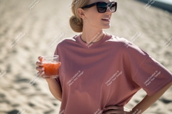 Woman holding pink drink sunglasses beach Product Image 1