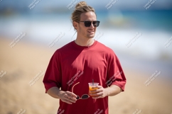 Man holding drink sunglasses beach ocean Product Image 1