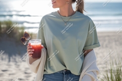 Woman holding drink sunglasses beach image Product Image 1