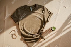 Olive green t shirt mockup with plant and bracelet Product Image 1