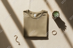 Folded olive t shirt with succulent and jewelry mockup Product Image 1