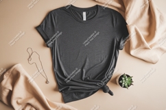 Dark grey t shirt with necklace and plant Product Image 1