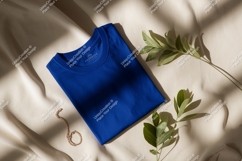 Blue shirt with green leaves and jewelry mockup fabric Product Image 1