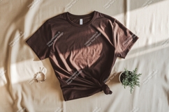 Brown t shirt mockup with plant and bracelet image Product Image 1