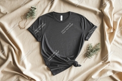 Dark gray t-shirt mockup with gold necklace and greenery Product Image 1