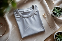 Folded grey t shirt with plants and jewelry mockup Product Image 1