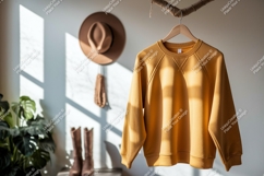Mustard yellow sweatshirt hanging indoors mockup clothing Product Image 1