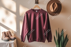 Maroon sweatshirt hanging with hat and boots clothing Product Image 1