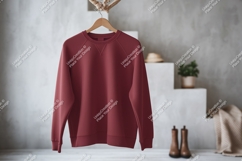 Maroon sweatshirt hanging on hanger raglan crewneck Product Image 1