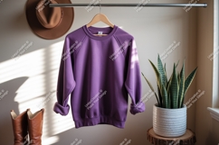 Purple sweatshirt hanging on rack clothing mockup Product Image 1