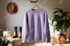 Lavender sweatshirt hanging indoors clothing apparel Product Image 1
