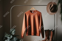 Orange sweatshirt brown hat boots plant clothing apparel Product Image 1