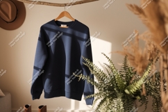Navy blue sweatshirt hanging on branch garment Product Image 1