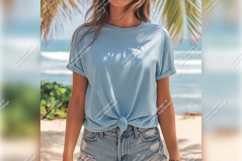 Woman In Blue Tshirt Mockup On Beach Product Image 1