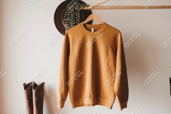 Mustard yellow raglan sweatshirt hanging clothing Product Image 1