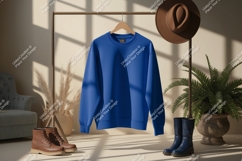 Blue sweatshirt hanging on rack with boots hat clothing Product Image 1