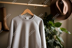 Gray sweatshirt hanging on wooden hanger clothing Product Image 1