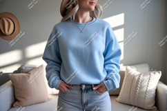 Woman wearing light blue sweatshirt and jeans casual Product Image 1