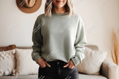 Woman wearing sage green sweatshirt and black jeans Product Image 1