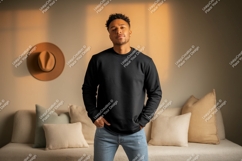 Man wearing black sweatshirt blue jeans Product Image 1