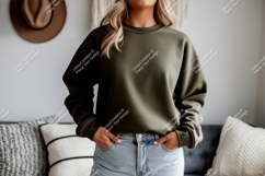 Woman wearing olive green sweatshirt and denim image Product Image 1