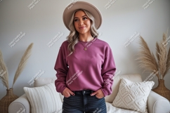 Woman wearing plum sweatshirt and hat jeans Product Image 1